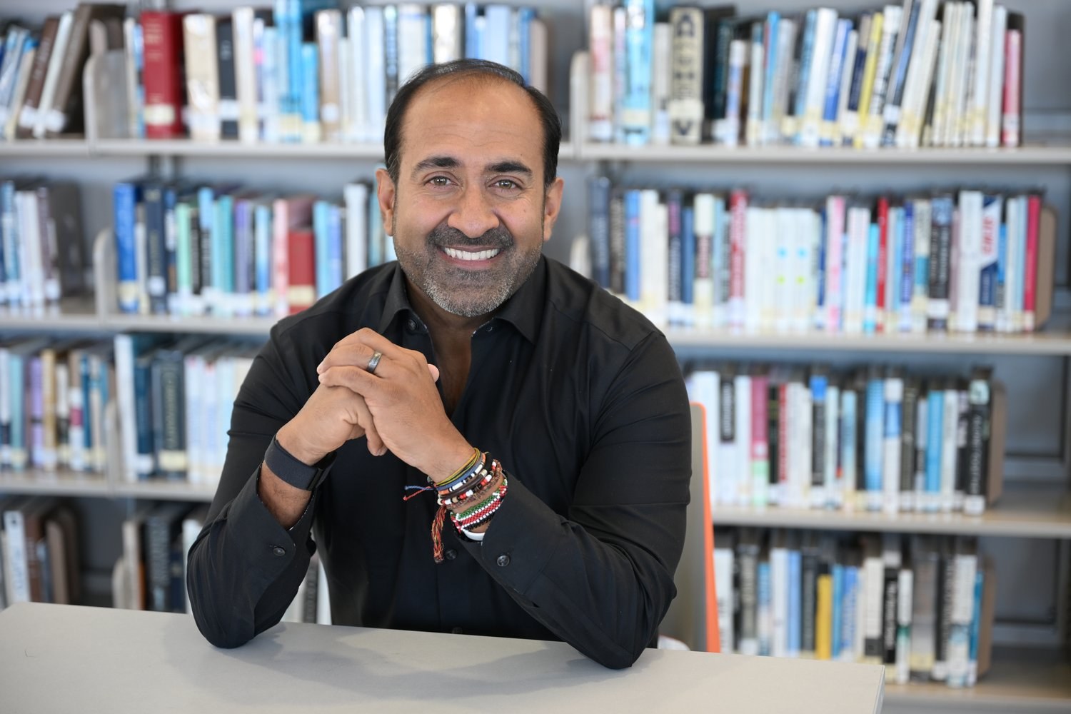Rohit Bhargava sitting at a table in a library